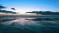 Cinematic aerial timelpase of the sunset at the coast of England