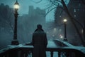 Cinematic back view of cinematic young man in winter coat walking outside in urban city on bridge on a moody, foggy, winters night Royalty Free Stock Photo