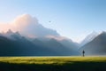 Cinematic and surreal image of a woman walking through green meadows at sunset with blue mountains in the background,