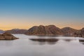 Cinematic lake surrounded by red cliffs in Provincia de Mendoza, Argentina Royalty Free Stock Photo