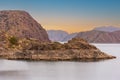 Cinematic lake surrounded by red cliffs in Provincia de Mendoza, Argentina Royalty Free Stock Photo