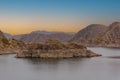 Cinematic lake surrounded by red cliffs in Provincia de Mendoza, Argentina Royalty Free Stock Photo