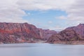 Cinematic lake surrounded by red cliffs in Provincia de Mendoza, Argentina Royalty Free Stock Photo