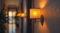 Cinematic perspective of a wall lamp casting a gentle, warm glow, adding a touch of elegance and s Royalty Free Stock Photo