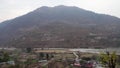 Cinematic Shot: Pyramid-Shaped Mountains with Riverside Village, Uttarkashi, Uttarakhand, India