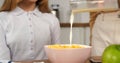 Cinematic slow-pour of milk into cereal perfect for family breakfast Healthy delicious beginning day family breakfast Royalty Free Stock Photo