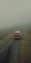 Cinematic Still Shot: Red Van On Foggy Road