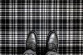 cinematic view of grey and black tartan rug