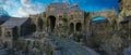 Cinematic view of a medieval fantasy castle in the mountains with stone bridge over a river gorge. 3D rendering Royalty Free Stock Photo