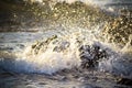 Cinematic View Sea Water Waves Breaking On Chunks Of Rocks Of Tropical Beach Village