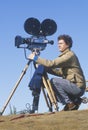 A cinematographer setting up his camera, Los Angeles, CA