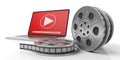 Film movie reels and a laptop on a white background, isolated, 3d illustration. Royalty Free Stock Photo