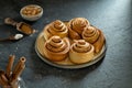 Cinnabon buns with cinnamon sticks and sugar