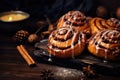 Cinnabon Buns with glaze on wooden background, autumn leaves