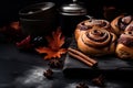 Cinnabon Buns with glaze on wooden background, autumn leaves