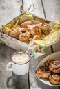 The Cinnabon in the plate and bowl with a mug of coffee.