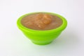 Cinnamon applesauce in a green bowl on a tablecloth Royalty Free Stock Photo