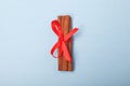 Cinnamon bandaged with red ribbon Royalty Free Stock Photo