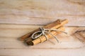 Cinnamon bundle on wooden background Royalty Free Stock Photo