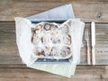 Cinnamon buns with cream-cheese icing in a baking dish over a ru Royalty Free Stock Photo