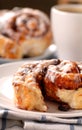 Cinnamon buns with a cup of coffee Royalty Free Stock Photo