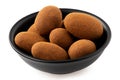 Cinnamon and chocolate coated almonds in a bowl isolated Royalty Free Stock Photo