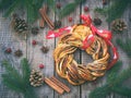 Cinnamon cocoa brown sugar wreath buns. Sweet Homemade christmas baking. Roll bread, spices, decoration on wooden background. New Royalty Free Stock Photo