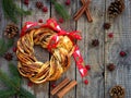 Cinnamon cocoa brown sugar wreath buns. Sweet Homemade christmas baking. Roll bread, spices, decoration on wooden background. New Royalty Free Stock Photo