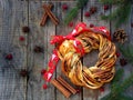 Cinnamon cocoa brown sugar wreath buns. Sweet Homemade christmas baking. Roll bread, spices, decoration on wooden background. New Royalty Free Stock Photo