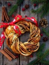 Cinnamon cocoa brown sugar wreath buns. Sweet Homemade christmas baking. Roll bread, spices, decoration on wooden background. New Royalty Free Stock Photo