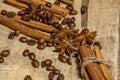 Cinnamon and coffee beans, anise stars - a mixture of spices on a wooden table. View from above. Close-up. Royalty Free Stock Photo