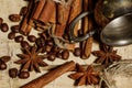 Cinnamon and coffee beans, anise stars - a mixture of spices on a wooden table. View from above. Close-up. Royalty Free Stock Photo