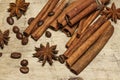 Cinnamon and coffee beans, anise stars - a mixture of spices on a wooden table. View from above. Close-up. Royalty Free Stock Photo