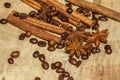 Cinnamon and coffee beans, anise stars - a mixture of spices on a wooden table. View from above. Close-up. Royalty Free Stock Photo