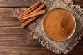 Cinnamon on dark wooden background Royalty Free Stock Photo