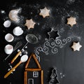 Cinnamon house on the table is complemented by a chalk pattern and utensils for making cookies. Royalty Free Stock Photo