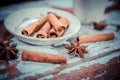 Cinnamon on a plate, Vitaly background Royalty Free Stock Photo