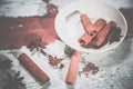 Cinnamon on a plate, Vitaly background Royalty Free Stock Photo