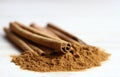 Cinnamon powder and sticks. Royalty Free Stock Photo