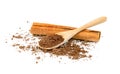 Cinnamon powder and sticks with wooden spoon isolated on a white background Royalty Free Stock Photo