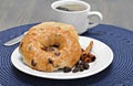 Cinnamon Raisin Bagel, buttered and toasted.