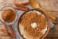 Cinnamon rice pudding risengrod close up in the bowl. Horizontal top view Royalty Free Stock Photo