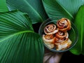 cinnamon roll cake with raisins and a sprinkling of nuts Royalty Free Stock Photo