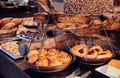 Cinnamon roll and cherry danish pastry on wooden tray hanging on Royalty Free Stock Photo