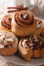 Cinnamon rolls with almond macro on a plate and coffee. vertical