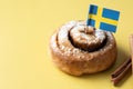 Cinnamon rolls buns on yellow background. Kanelbulle Swedish dessert