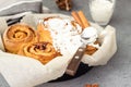 Cinnamon rolls Cinnabon baked in a cast iron skillet with cream cheese icing Royalty Free Stock Photo