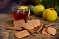 Cinnamon rols, fruits, cookies and cup of tea