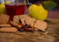 Cinnamon rols, fruits, cookies and cup of tea