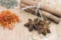 Cinnamon, safron, star anise and peper on a wooden table Royalty Free Stock Photo